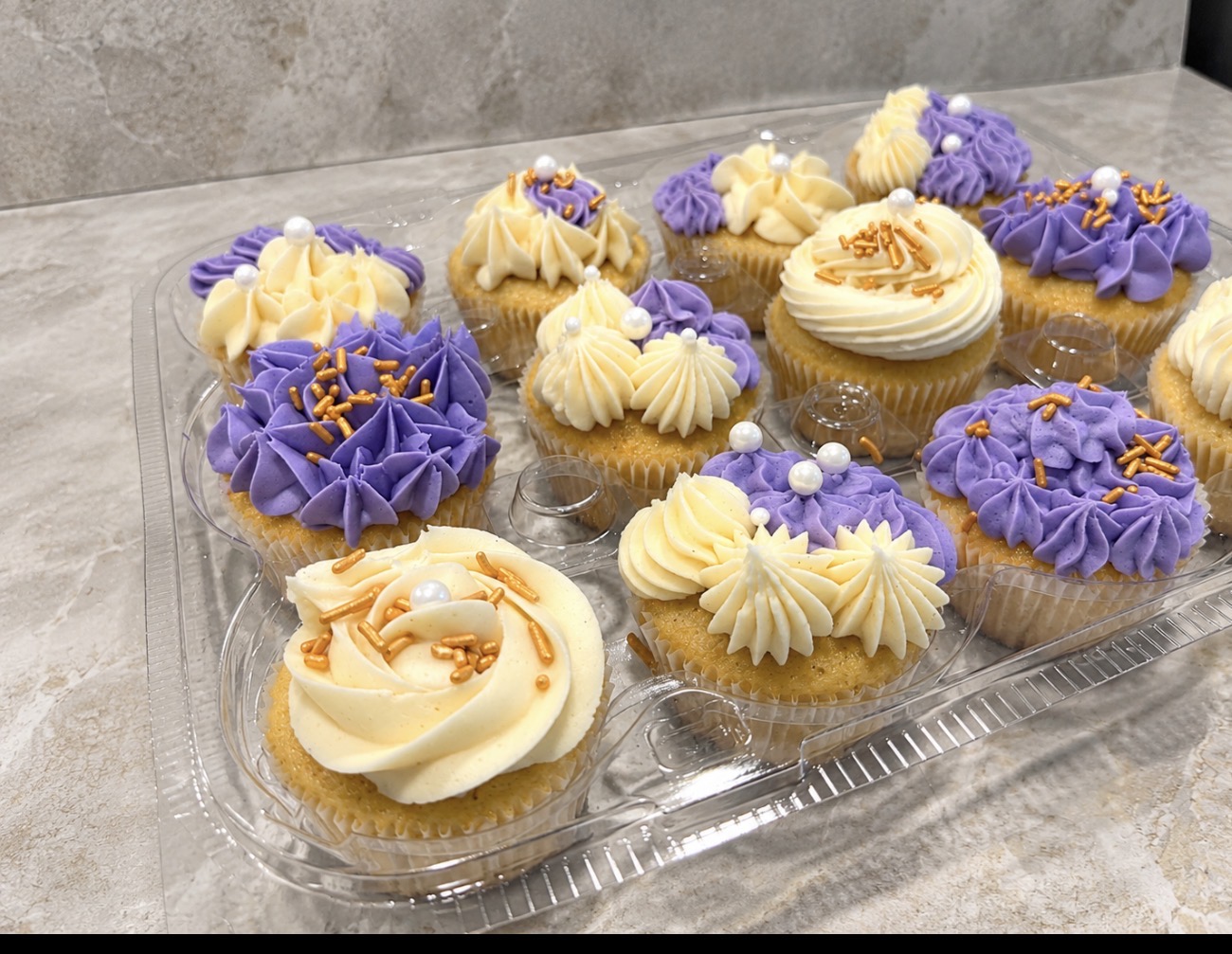 Purple & cream cupcakes with gold sprinkles and pearls